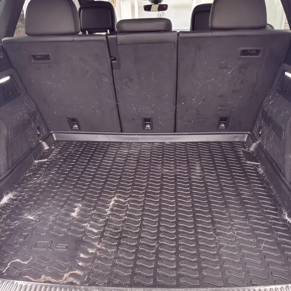 Before: Audi Q5 cargo area, covered in dog hair and sand before, clean after