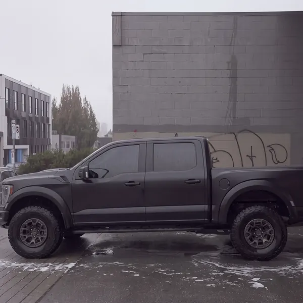 After: Ford Raptor side profile, caked in mud before, clean after