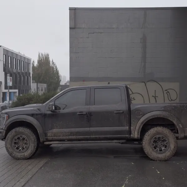 Before: Ford Raptor side profile, caked in mud before, clean after